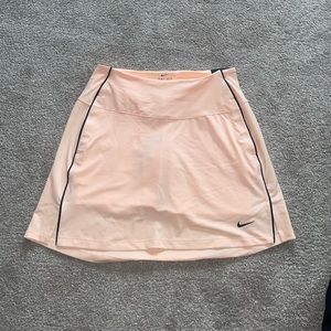 New with tags, pink Nike golf skirt